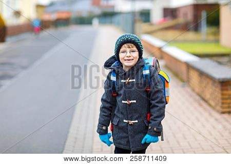 Little Kid Boy With Eye Glasses Walking From The School