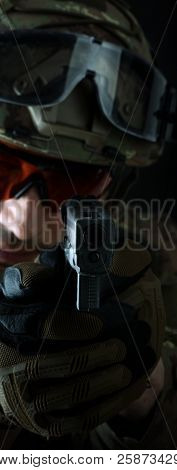 Aiming At The Camera Focus On The Muzzle Of Gun
