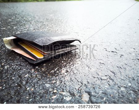Wallet With Money Droped On The Street With Money And Bank Cards, Lost Money Concept, Copy Space For