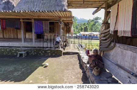 Luba, Indonesia - May 19: Unidentified People Sit In Front Of Their Houses On May 19, 2017 In Luba, 