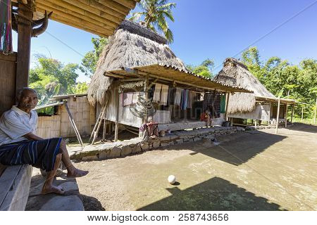 Luba, Indonesia - May 19: An Unidentified Man Relaxes On His Front Porch On May 19, 2017 In Luba, In