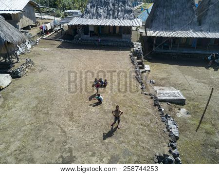 Luba, Indonesia - May 19: Unidentified Kids Play In Front Of Traditional Houses On May 19, 2017 In L