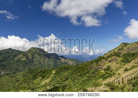 View From The Bena Village Of A Dramatic Valley And Ocean Beyond Near Bajawa, Indonesia.