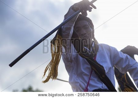 Bajawa, Indonesia - May 19: An Unidentified Man Performance Intricate Harvest Dance Moves Near Bajaw