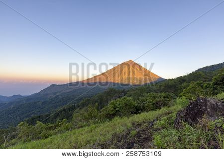 Dawn Light Hits Mount Inerie, A Volcano In Flores, Indonesia.