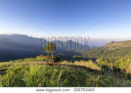 Beautiful Valley With God Rays Below Mount Inerie In Flores, Indonesia.