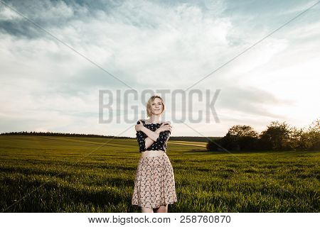 Young Girl In A Green Field. Stylish Girl. Green Grass And Blue Sky. Emotional Woman. Plener. Travel