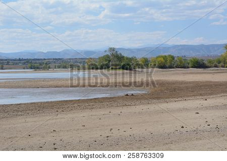 Increase Of Dry Beach Land With Decreasing Water Level At Lake Standley Reservoir In Westminster Col