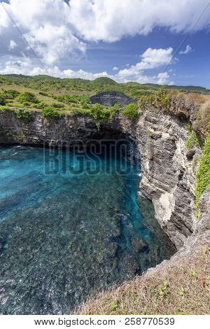 A Portrait View Of The Rock Arch At Broken Beach, A Popular Tourist Destination On Nusa Penida.