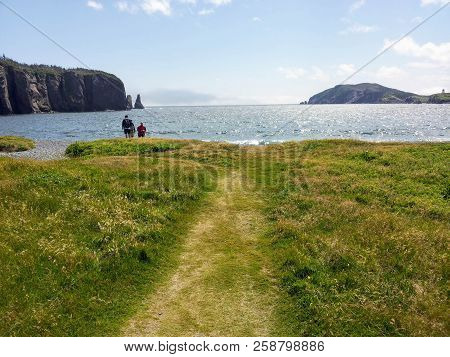 Admiring The Beautiful Sights Of The Skerwink Trail Outside Of Trinity, Along The Rugged Coasts Of N