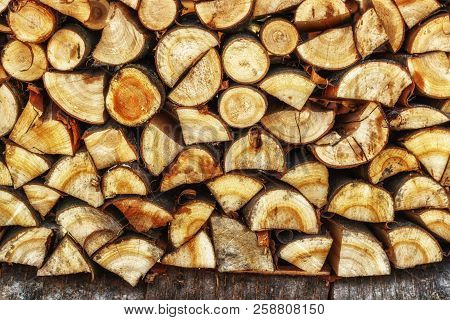 Firewood For The Winter. Firewood For Barbecue. A Background Made Of Wood. Cut And Chopped Logs With