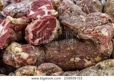 Closeup, Assorted Different Kinds Of Meat: Salami, Sausages, Smoked Meat.