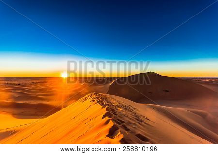 Sunrise In The Sahara Desert Next To M'hamid In Morocco