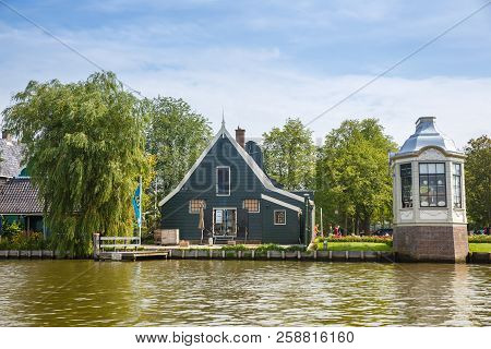 Zaanse Schans, Netherlands, August 19, 2015 - Traditional Dutch Houses And People At The Canal.