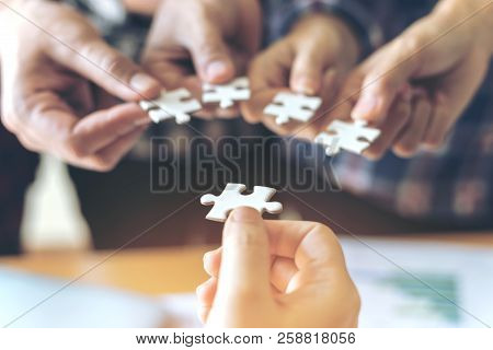 Close Up Hand Of Group Business Partnership People Puting Together A Jigsaw Puzzle  , Business Teamw