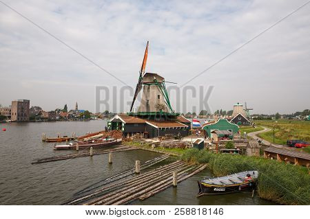 Zaanse Schans, Netherlands, August 19, 2015 - Traditional, Authentic Dutch Windmills At The River Za