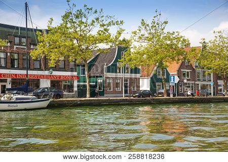 Zaanse Schans, Netherlands, August 19, 2015 - Traditional Dutch Houses And Boats At The Canal.
