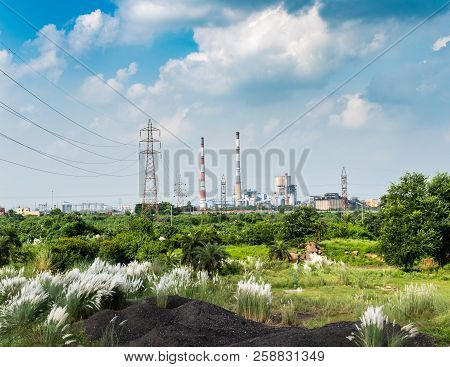Beautiful Kans Grass Blooming Overlooking A Power Plant Industry.