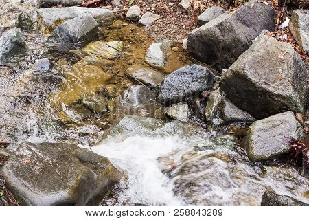 Autumn Waterfall With Rocks And Leaves In Troodos Mountains In Cyprus