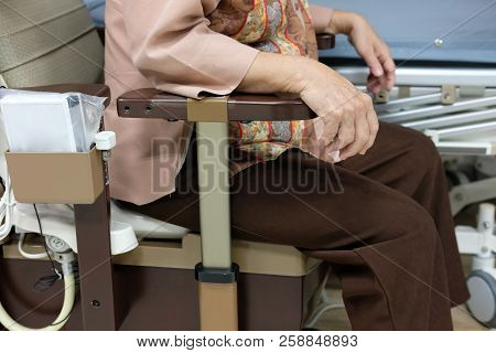 Old Woman Use Portable Mobile Plastic Toilet Near  Patient Bed