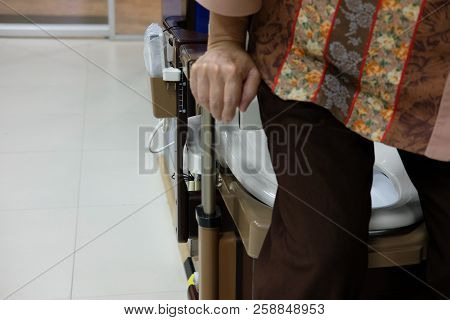 Old Woman Use Portable Mobile Plastic Toilet Near  Patient Bed