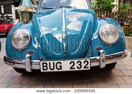 Saalbach-hinterglemm, Austria - June 21 2018: Vintage Car Volkswagen Beetle Oldsmobile Veteran On Ju