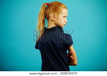 Horizontal Shot Of Offended Child, Turned Away From Camera, Stands With His Back, Turns Around And G