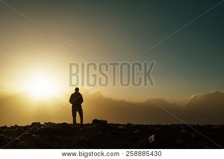 Wanderlust time. Man hiking in beautiful Fann mountains in Pamir, Tajikistan. Central Asia.