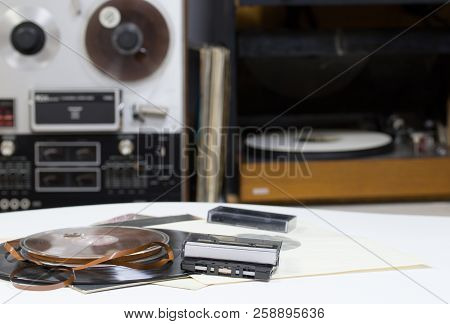 Vinyl Record With Copy Space In Front Of A Collection Albums Dummy Titles. Reel Tape Recorder. Audio