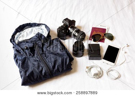 Top View Of Traveling Accessories White Backgroun.