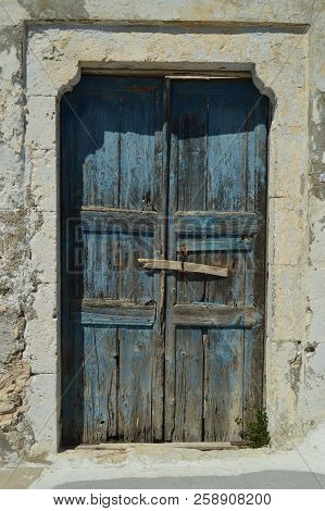 Beautiful Blue Wooden Door Of A Typical House In Pyrgos Kallistis On The Island Of Santorini. Travel
