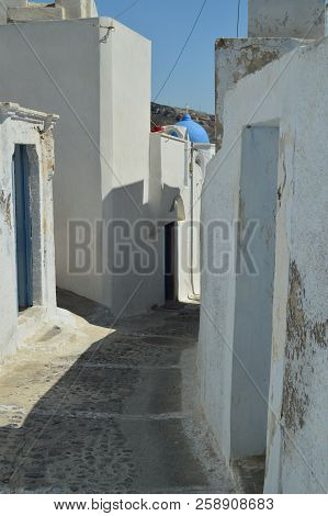 Typical Narrow And Serpentant Streets At Pyrgos Kallistis On The Island Of Santorini. Travel, Cruise