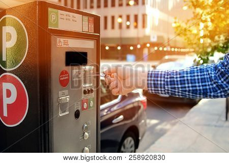 Man Is Paying His Parking Using Credit Card At  Parking Pay Station Terminal