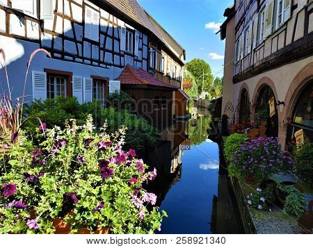 Beautiful Flowers And Picturesque Canal In Wissembourg, France