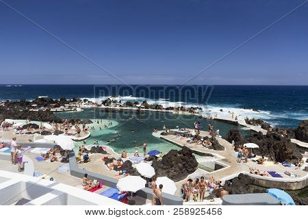 Porto Moniz, Portugal - August 7: Unidentified People Enjoy The Piscinas Naturais Or Natural Ocean P