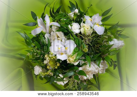 Luxury Wedding Bouquet On A Green Background. Elegant Composition Of Roses. Close-up View Of A Vibra