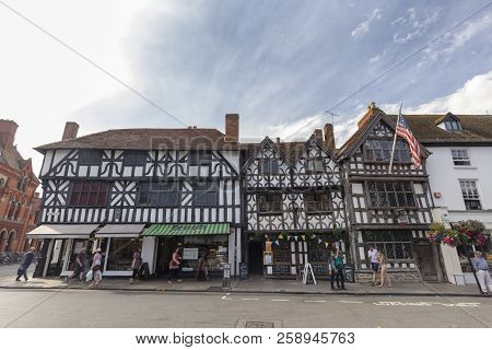 Stratford-upon-avon, United Kingdom - August 24: Unidentified Pedestrians Walk Past Traditional Stor