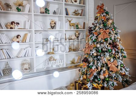 The Bedroom Decorated For Christmas. Cozy Home Interior. New Year Decoration. White Room With Large 