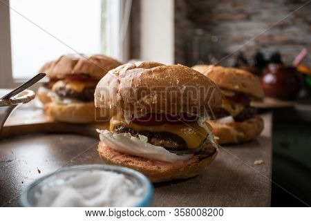 Classic Gamburger With Tomato On Wooden Board