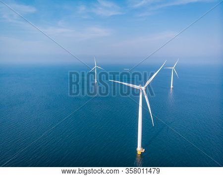 Wind Turbine From Aerial View, Drone View At Windpark Westermeerdijk A Windmill Farm In The Lake Ijs
