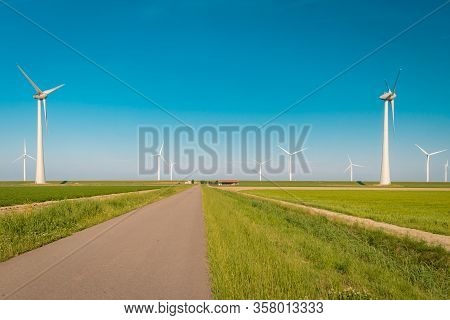 Wind Turbine From Aerial View, Drone View At Windpark Westermeerdijk A Windmill Farm In The Lake Ijs