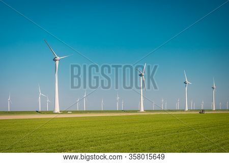 Wind Turbine From Aerial View, Drone View At Windpark Westermeerdijk A Windmill Farm In The Lake Ijs