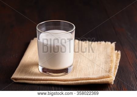 Top View Fermented Drink Kefir In A Glass On Wooden Background.