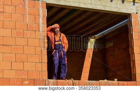 Daily Routine At Construction. Well Done. Repairman Tired Builder Relaxing At Construction Site. Bui