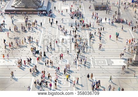 Milan, Italy, September 9, 2018: Crowd Of Small Figures Of Many People Are Walking And A Lot Of Pige