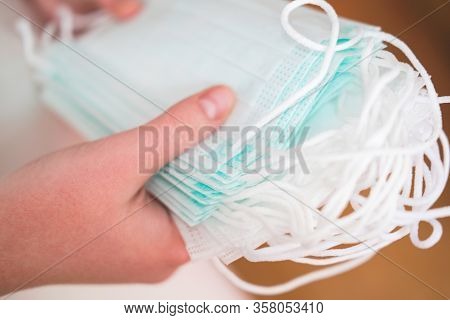 Human Hand Holding Medical Face Masks. Coronavirus Or Covid -19 Prevention. Clobal Pandemic. Virus S