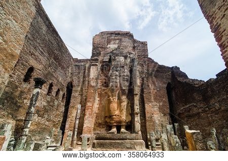 Headless Buddha Statue In In Lankatilaka Vihara, Part Of The Polonnaruwa World Heritage Site In Sri 