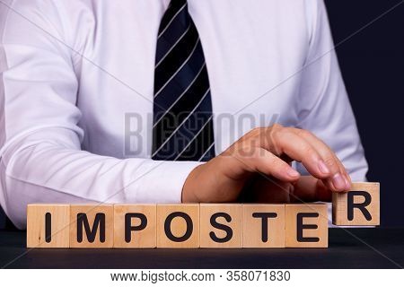 Man Made Word Imposter With Wood Blocks