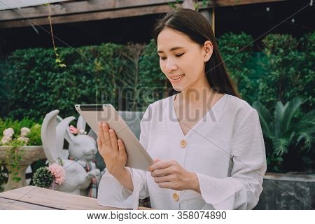 Working Women Stay Home Use Tablet Work At Home And Meeting With Team Online By Internet,wfh Concept