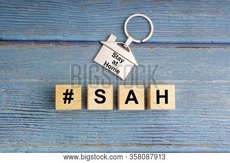Concept Image A Wooden Block And Word - #sah ( Stay At Home ) On Wooden Background. Coronavirus And 